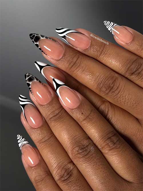 Unique mixed animal print French manicure with zebra, giraffe, and black-and-white tips over a nude base, showcasing bold style.