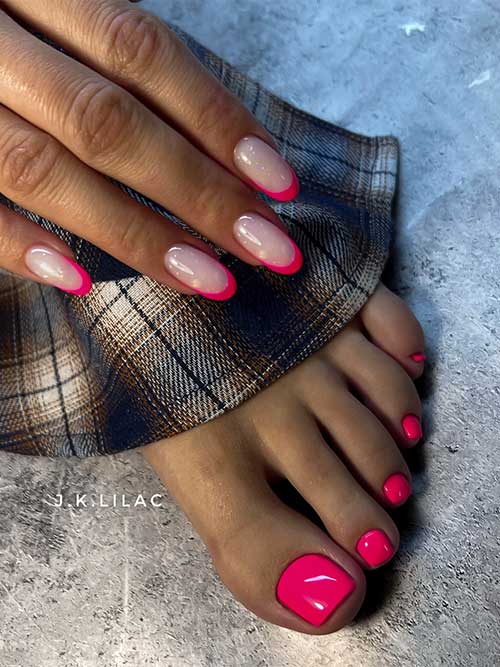 Bold red manicure with nude and red French tips, paired with glossy solid red toenails for a playful yet refined look.