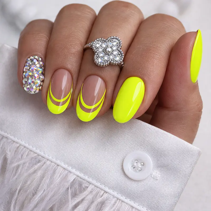 Short Neon Yellow Nails with French Tip Accent Nails and Silver Rhinestones on the Pinky Nail