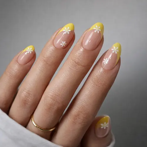 French tip press on nails in a semi-transparent soft gel with a daisy design, for easy at-home manicures.