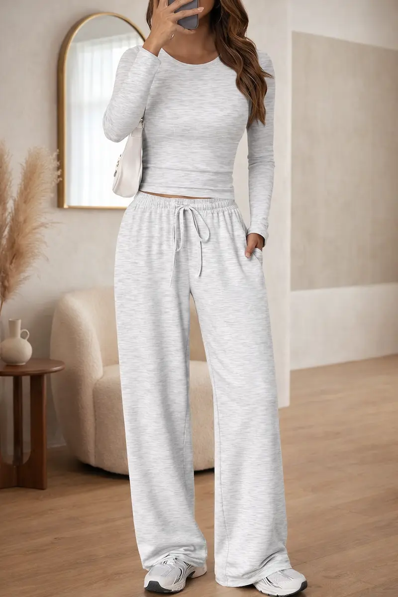 Upgrade your everyday style with this must-have Trendy Queen Women's 2 Piece Matching Lounge Set. Featuring a flattering long sleeve side ruching top and comfortable wide leg drawstring pants with pockets, this set is the ultimate Pinterest aesthetic outfit. Whether you're looking for the perfect airport outfit, casual chic streetwear, or a cozy matching sweatset for lounging at home, this versatile duo delivers. Made from soft, breathable fabric, it's the ideal Amazon fashion find for a polished yet effortless look. Perfect for travel, errands, or a relaxed weekend vibe.