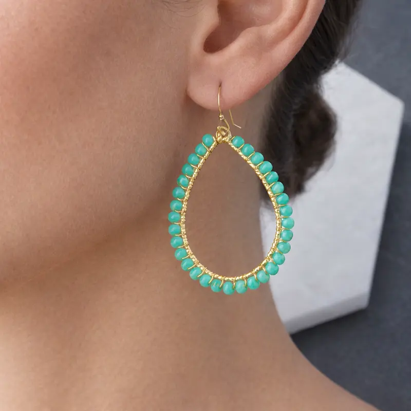 Bohemian wire-wrapped teardrop dangle earrings with teal faceted glass beads and gold plating